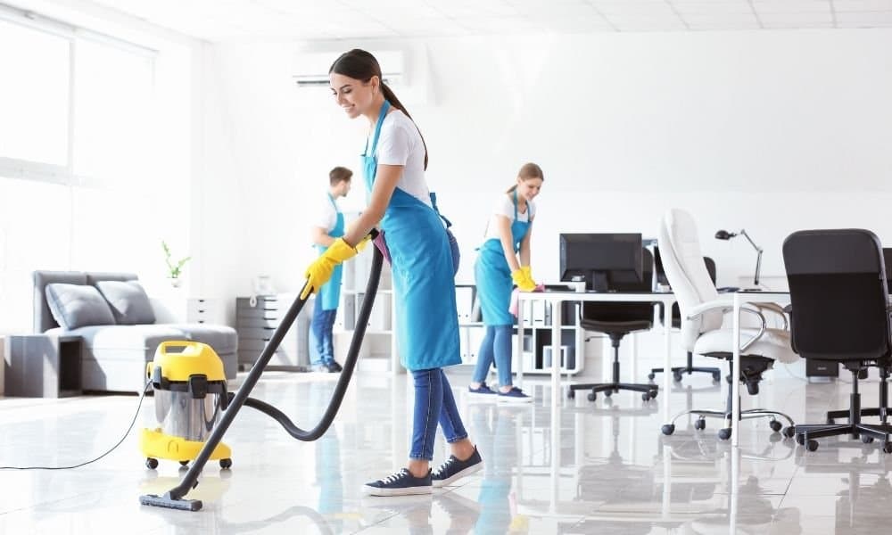 Cleaner wiping kitchen counter